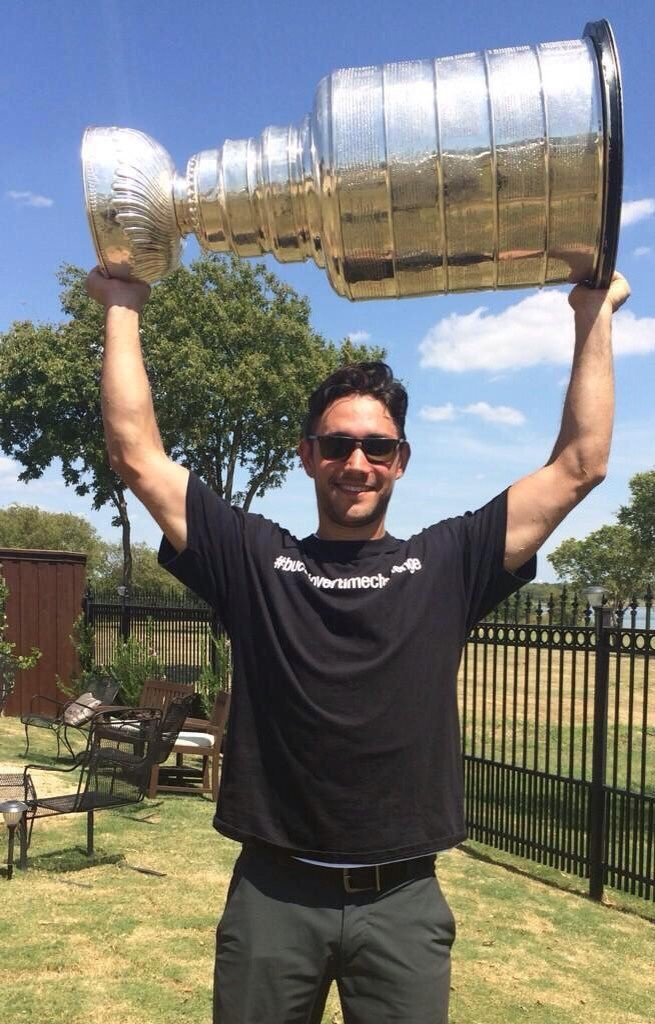 Buccigross's tweet image. (Alec with his #bucciovertimechallenge t shirt and Cup after Cup over Rangers on his OT goal)..and Vegas Cup. Good luck in TV, Alec. #brotherhood