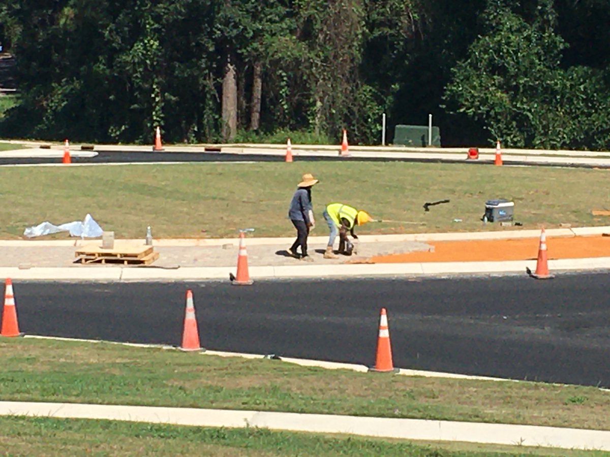 Fairhope_Times's tweet image. Installing  pavers at the new roundabout this morning; one of the final components  before completion. Veterans Drive should reopen by next week. #roundabout #flowerclock #fairhopenews