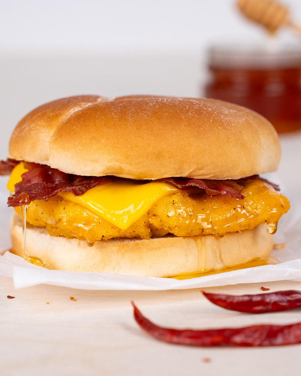 Have you tried the drizzle of sizzle yet? 🔥Our new Hot Honey Chicken Bacon Melt is stacked with crispy chicken, bacon, melty cheese, and drizzled with that sweet heat. You have seen it, now taste it for yourself!