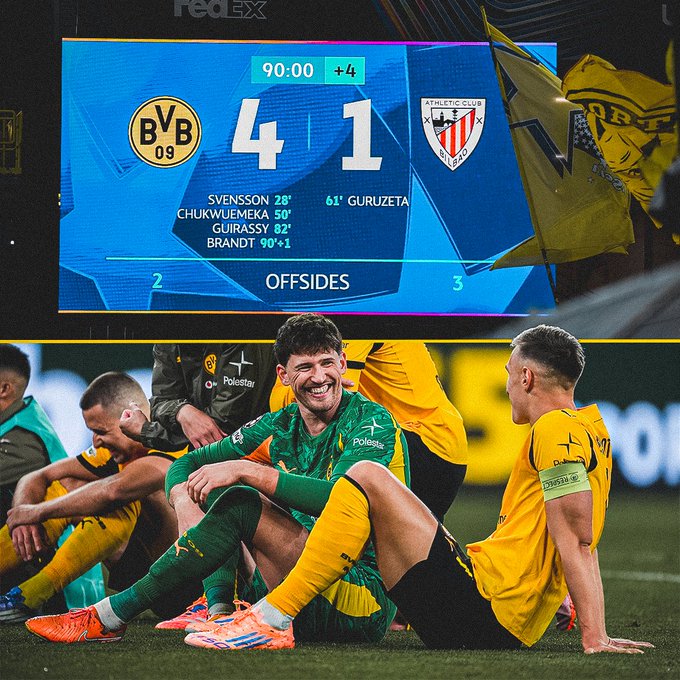 A scoreboard displaying Borussia Dortmund leading 4-1 against an opposing team, with goals scored by Svennson at 28 minutes, Chukwueze at 52 minutes, Gürz at 61 minutes, and Brandt at 90+1 minutes. Offsides are marked as 2 for Borussia Dortmund and 3 for the opposing team. Below, Borussia Dortmund players in yellow and black uniforms sit on the field, some smiling, wearing green and yellow kits with visible numbers and logos.
