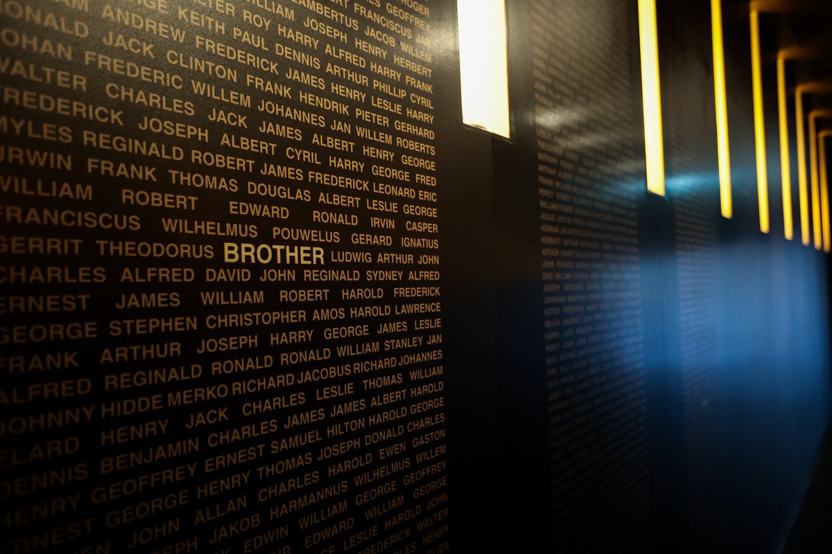 HellfirePass's tweet photo. Dark wall panels with POW first names. Among these are  words denoting family relationships -brother, husband, father, or friend — reminding us that behind the soldiers who endured the hardships of war were individuals who held many roles in life and were loved by their families. https://t.co/AZ3hejph1U