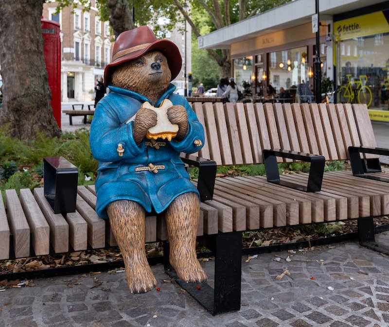Londonist's tweet photo. A wise bear always keeps a marmalade sandwich in his hat in case of emergency - and this bear (and his sandwich) can now be found in his new home at Connaught Village Green, near Marble Arch https://t.co/ChyXcFXy6X