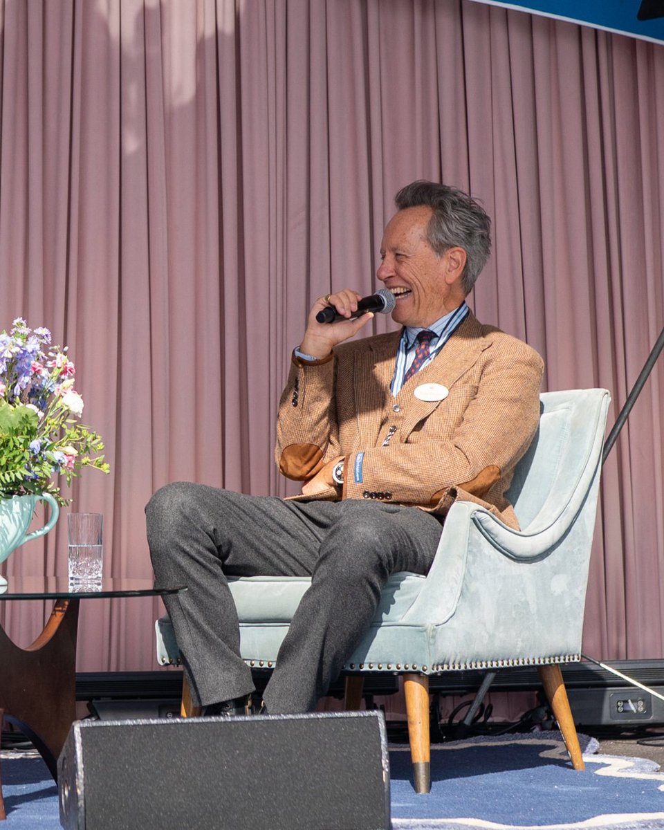 goodwoodrevival's tweet photo. At #GoodwoodRevival 2025 we hosted actor Richard E. Grant on the #RevivalStyle Stage, in conversation with Paula Sutton. You may know Grant from recent films such as Saltburn (2023), and his Oscar-nominated performance in Can You Ever Forgive Me (2018). He's also been featured in recent #Burberry events, including the Summer 2025 campaign, "It's Always Burberry Weather: London in Love," and the AW25 fashion show. Vintage on Film was the topic of discussion on stage, did you get a chance to hear a few of Grant's anecdotes?