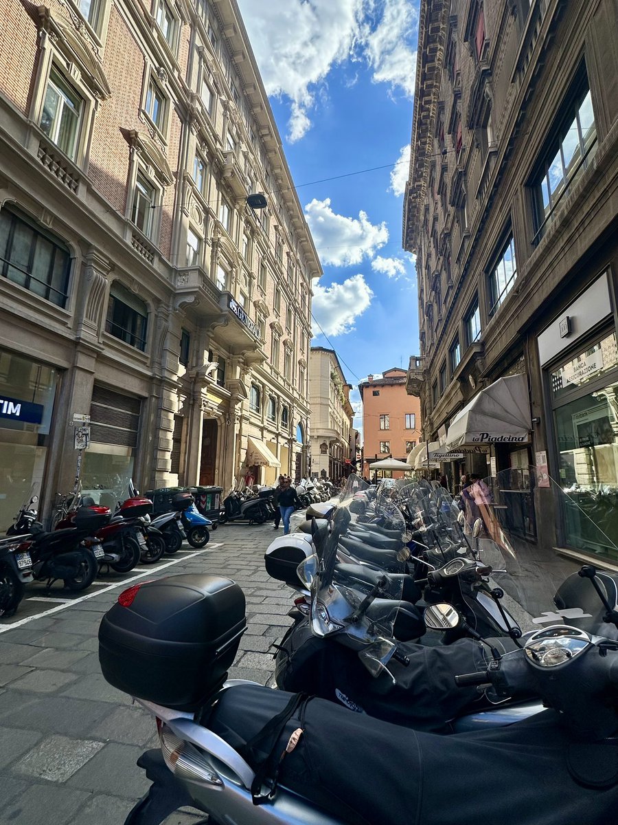 Motorcycles, scooters (all licensed and insured by the way) transport people in Bologna along with autos. Civilized driving.  Absence of rage. #ItalySOS