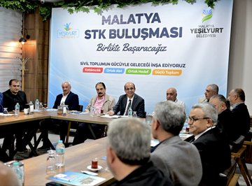 Multiple individuals seated at a rectangular table in a meeting, with water bottles, glasses, and documents visible. A backdrop displays text reading "MALATYA STK BULUŞMASI" and "Yeşilyurt Belediyesi," with additional text in Turkish. Another image shows a group of people standing outdoors in front of a building with a sign reading "Yeşilyurt Belediyesi."