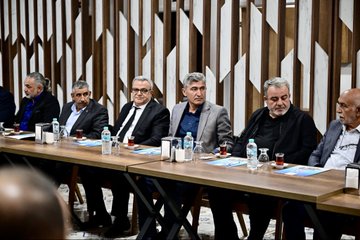 Multiple individuals seated at a rectangular table in a meeting, with water bottles, glasses, and documents visible. A backdrop displays text reading "MALATYA STK BULUŞMASI" and "Yeşilyurt Belediyesi," with additional text in Turkish. Another image shows a group of people standing outdoors in front of a building with a sign reading "Yeşilyurt Belediyesi."