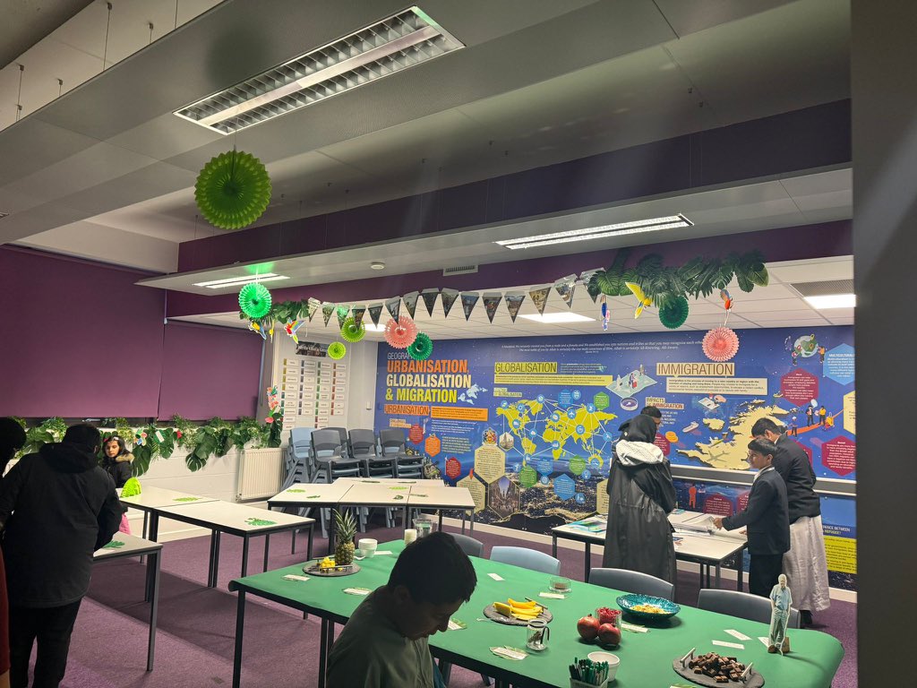 edenboysbolton's tweet photo. 🌍✨ Welcome to the Geography Department! Here you will find their creative rainforest-inspired display! 🐒🌿 Students explored the jungle, tasted rainforest fruits, and investigated facts – bringing learning to life in the most exciting way! 🍍🥭🌱 Mrs Cain is on hand to answer any curriculum questions. #WeAreStar