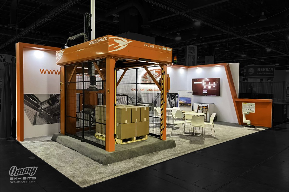 ommyexhibits's tweet image. Built a 15x30 booth for Odecopack at Pack Expo: open design w/ gantry palletizer, orange branding, lit 3D logo, video display &amp;amp; meeting areas. See it: ommyexhibits.com/odecopack-pack… #PackExpo #BoothDesign #PackagingAutomation #TradeShows