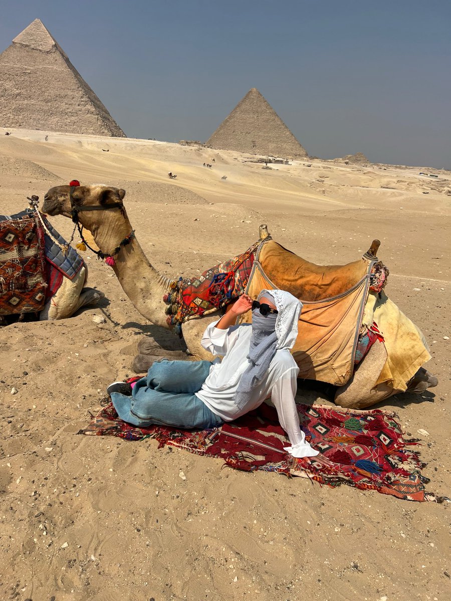 fatiful's tweet image. In the heart of the desert, where time itself bows to eternity, I found myself small yet infinite.
Among pyramids that have whispered secrets for thousands of years, I let the wind carry my spirit higher.
On camelback I traveled paths carved by kings and dreamers,
reminded that