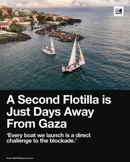 A coastal scene with sailboats on the water near a rocky shoreline with buildings and people. The text overlay reads "A Second Flotilla is Just Days Away From Gaza" and "Every boat we launch is a direct challenge to the blockade." A watermark from Novara Media is present.