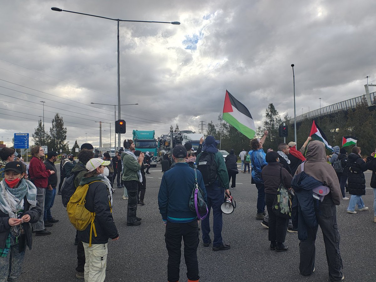 DaveMilbo's tweet photo. Activists have blocked the road leading to Webb Dock in Port Melbourne in solidarity with Palestine, the Sumud Flotilla, and the six Australians abducted illegally by Israel. https://t.co/uCICKdXmll