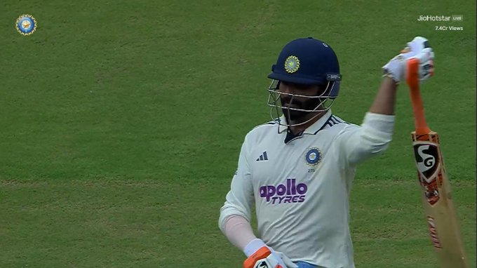 Ravindra Jadeja wearing a white cricket uniform with 