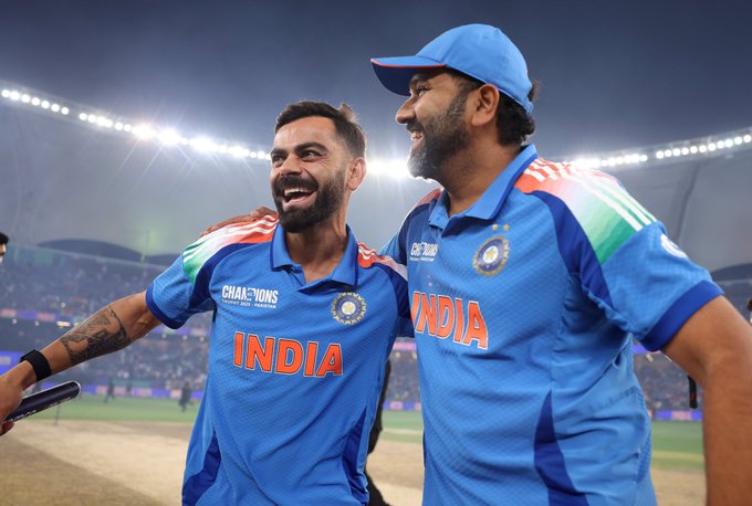 Rohit Sharma and Virat Kohli wearing blue India cricket jerseys with 