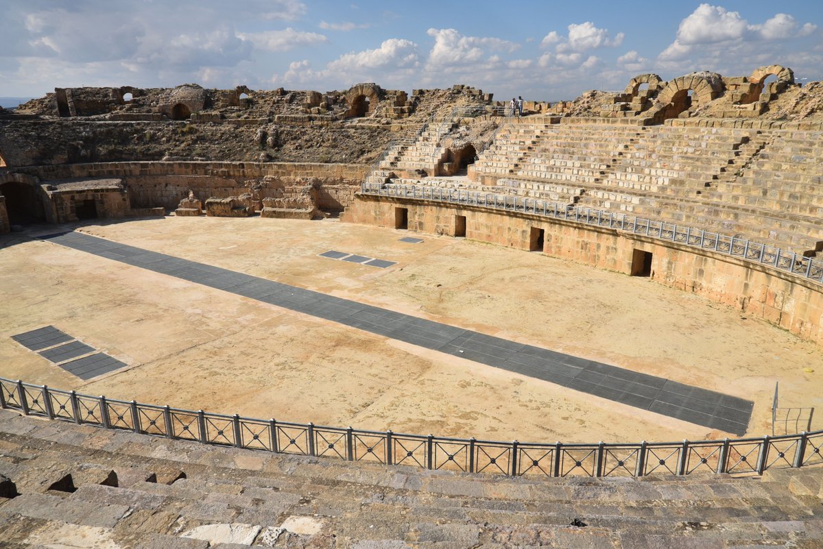 carolemadge's tweet photo. #RomanSiteSaturday - The amphitheatre of Uthina, with a capacity of around 16,000 spectators, was the third-largest theatre in Tunisia after those at Carthage and El Djem. The central arena measures 58mx35m. The nearly fully restored amphitheatre, situated on the northern edge of Uthina, dates to the reign of Hadrian. An underground vaulted gallery, aligned along a major axis, provides access to the amphitheatre’s basement, featuring symmetrical vaults and rooms beneath the central arena.
https://t.co/wjyozBFHgj