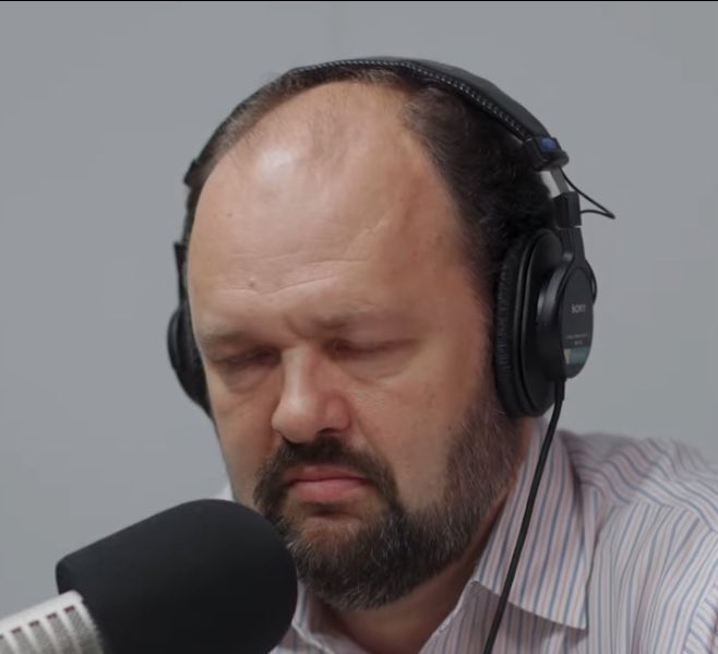 palantirplayboy's tweet photo. a man listening to hasan piker https://t.co/UKWRLwETQ3