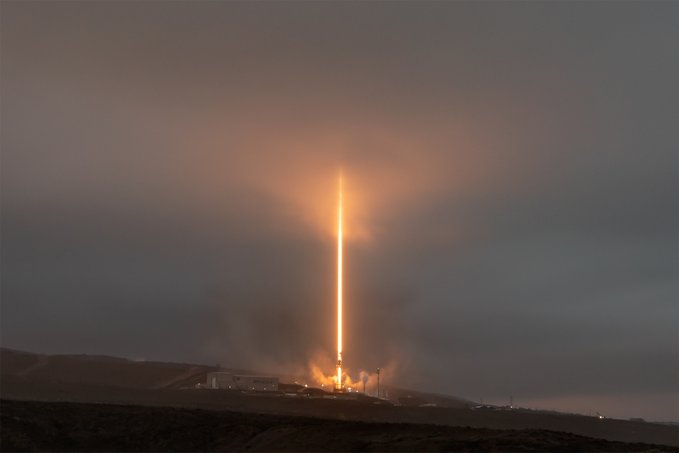 A rocket, Falcon 9, launching with bright flames and smoke at its base, ascending vertically into a cloudy sky. Starlink satellites are not visible. A second image shows the Earth\'s curvature with a row of solar panels against a dark space background, sunlight illuminating the scene.
