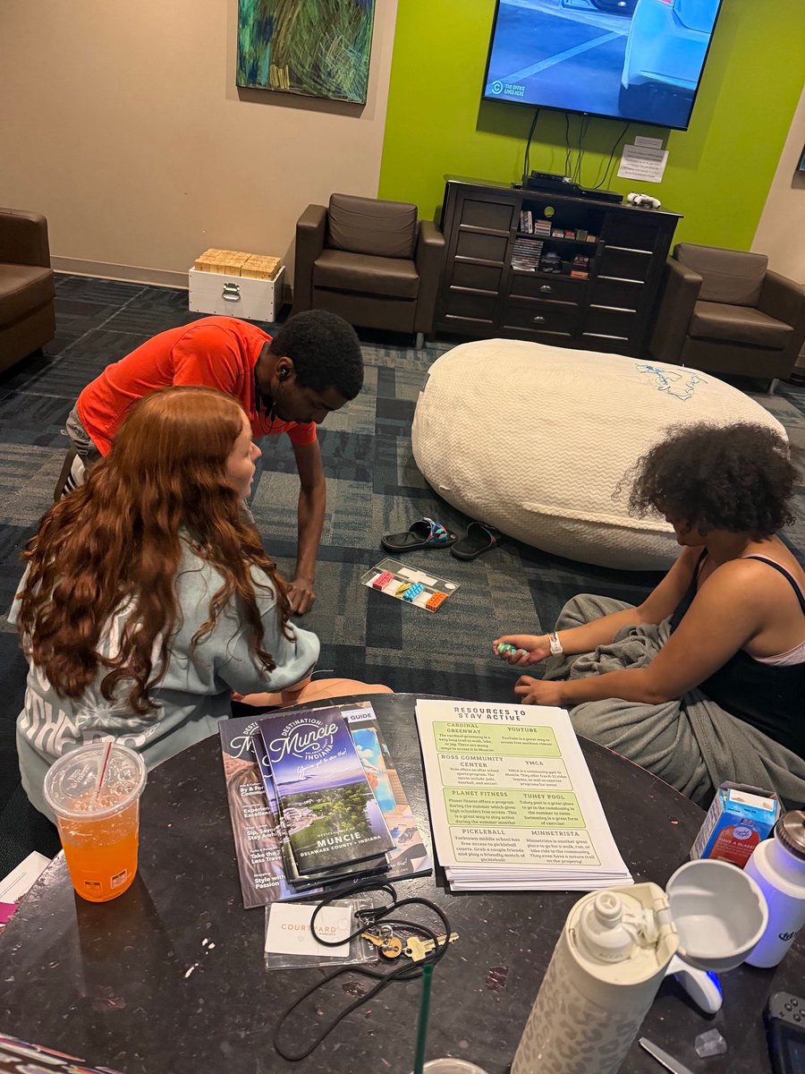 Pictured here are students and a community mentor hanging out and playing games! 

We’re thankful for great <a href="/BallState/">Ball State</a> students who serve as community and fitness mentors.