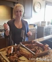 Isn't this a picture of the Ostrich farm owner, with a carving knife and a roasted Ostrich???