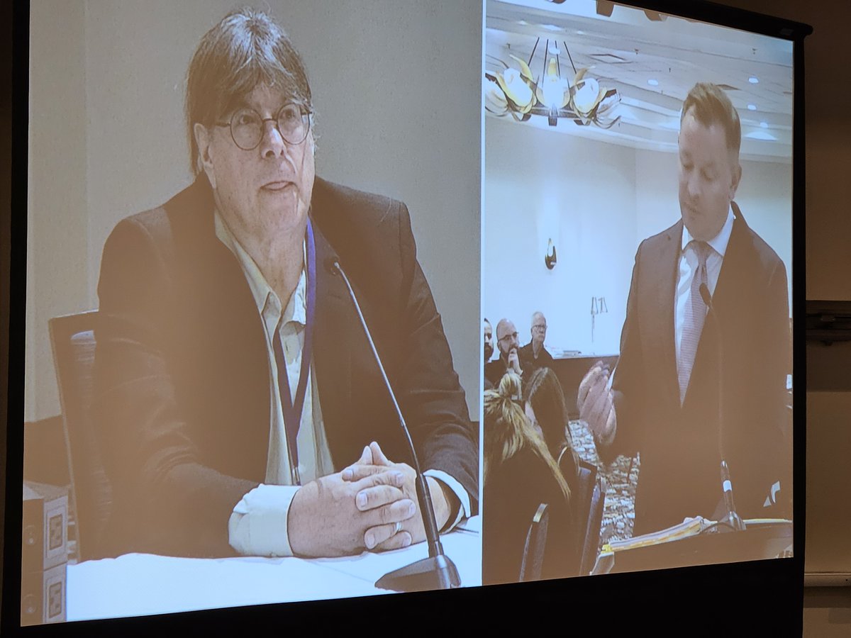 SaskTLA's tweet photo. Nicholas M. Cann, K.C. - McKercher LLP questions "Dr. Edward Sharp - Medical Examiner" played by local actor Brian Ludwig. STLA Fall Conference Mock Trial case of Dixon v. Providential Life. https://t.co/0uyoNjxPFb