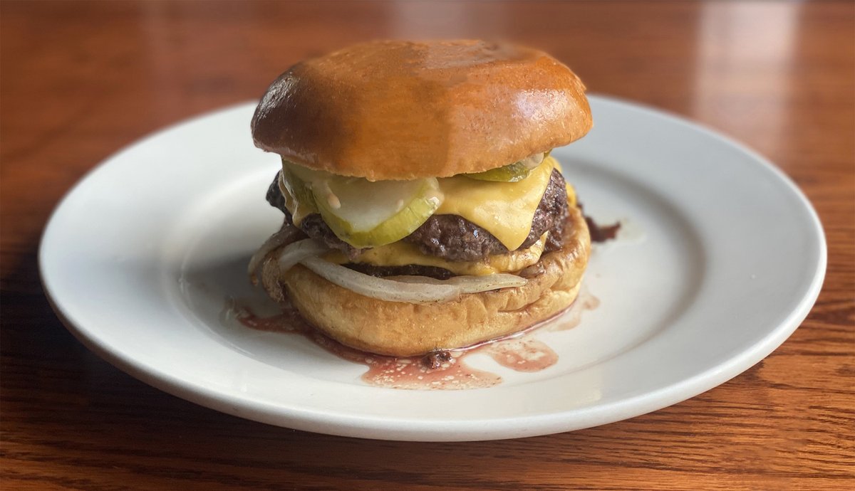 One of our LATE NIGHT offerings: a #SlagelFamilyFarm Smashburger, a 1/4-lb burger (custom blend of sirloin, short rib &amp; chuck), w/ American cheese, not secret sauce, pickles &amp; griddled onions. 10P-12A every Fri/Sat. Hit the website link for the late night menu📷TLM #chicagobars