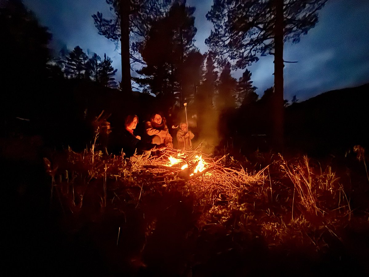 Enjoying a campfire in the calm before the storm.