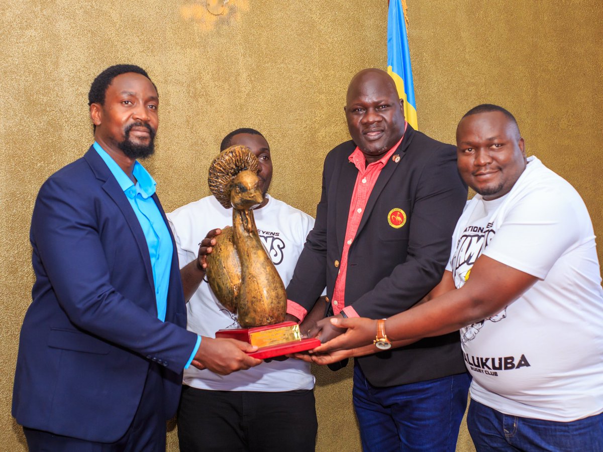 UgandaRugby's tweet photo. Earlier today, players and management of Walukuba Barbarians, accompanied by the Honorable Secretary of the Uganda Rugby Union, Mr. Peter Odong, and the Upcountry Representative, Mr. Duncan Kirya, formally presented the Nile Special Uganda 7s Overall Trophy and the Kyabazinga 7s Trophy both won by Walukuba Barbarians to the Kyabazinga of the Busoga Kingdom, His Majesty King Nadiope IV. @KingNadiopeIV