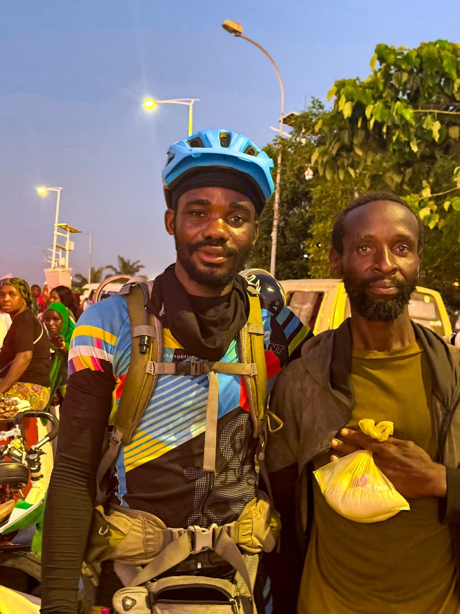 emmiwuks's tweet photo. DAY96 NIG2USA ON A BICYCLE 🇳🇬🚴🇺🇲
FAMILY, PLEASE READ THIS 🙏.
Tonight, I met a My Nigerian brother here in Guinea. His name is Olugbenga Oshimowo, 45 years old, from Lagos State.

He left Nigeria in 2021 with the dream of finding a better life, but unfortunately got stranded in Mali. He was arrested, detained, and in the process, he lost everything. Now he is stuck in Guinea with no means to return home.

Gbenga sleeps around the Airport Roundabout here in Conakry, because he has nowhere else to go. 

According to him, he has family in the USA, a sister named Arinola Gudonu and a cousin Moronike Ayodele,  but he has lost contact and has no way to reach them.

When I asked him if he would like to return to Nigeria, his answer was “Yes.

The best way I can help is to share his story with the world, believing that through the power of humanity, compassion, and connection, someone out there can step in to help this brother find his way back home.

If you know him, his family, or any way we can support his return, please reach out. Let’s not allow one of our own to be lost in a foreign land. ✊🏾❤️🇳🇬

Together, we can bring Gbenga back home.
GOD BLESS AFRICA.

#NIG2USA #nigeria #africa #fypシ゚ 

@renoomokri @ruffydfire @PoojaMedia