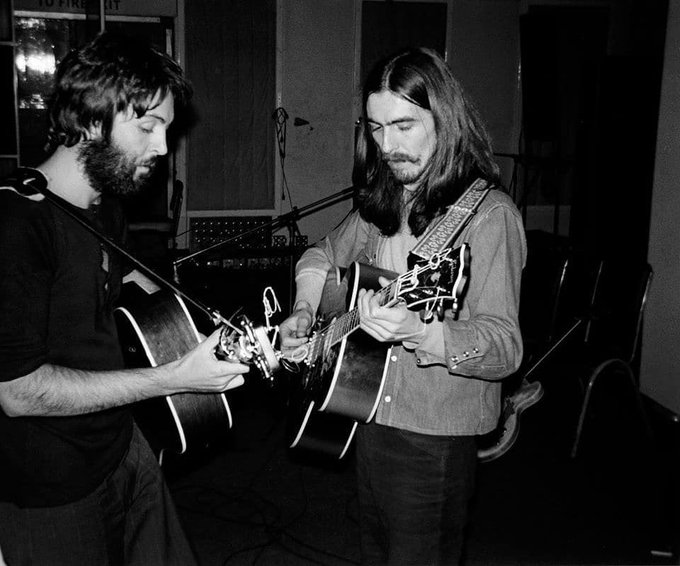 paul mccartney and george harrison working on the acoustic guitars for i me mine. this photo happens to be among the last photos of the beatles in a recording studio together before their official breakup.
(january 3, 1970)