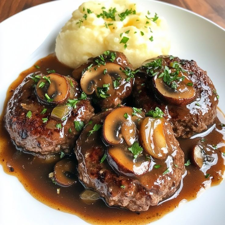 NThanh86518's tweet photo. Rich, savory Salisbury steak smothered in a mushroom gravy, served with creamy mashed potatoes!🍽️🥣🥢 https://t.co/nh0Kt1FMZG