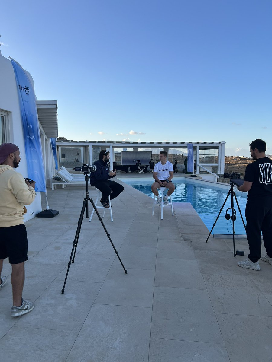 Curvit team filming at IslandDAO event by the pool