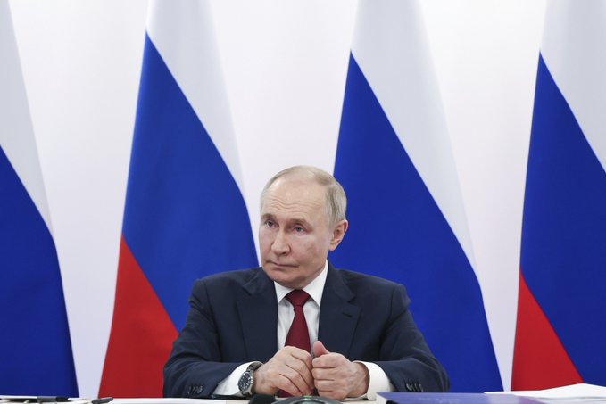 Vladimir Putin sitting at a table, wearing a dark suit and red tie, with hands clasped. Behind him are multiple Russian flags with blue, white, and red stripes. A separate image shows a display with the word "BRICS" in large letters, "BRASIL 2025" below, and flags of various countries including Russia, Brazil, and others.