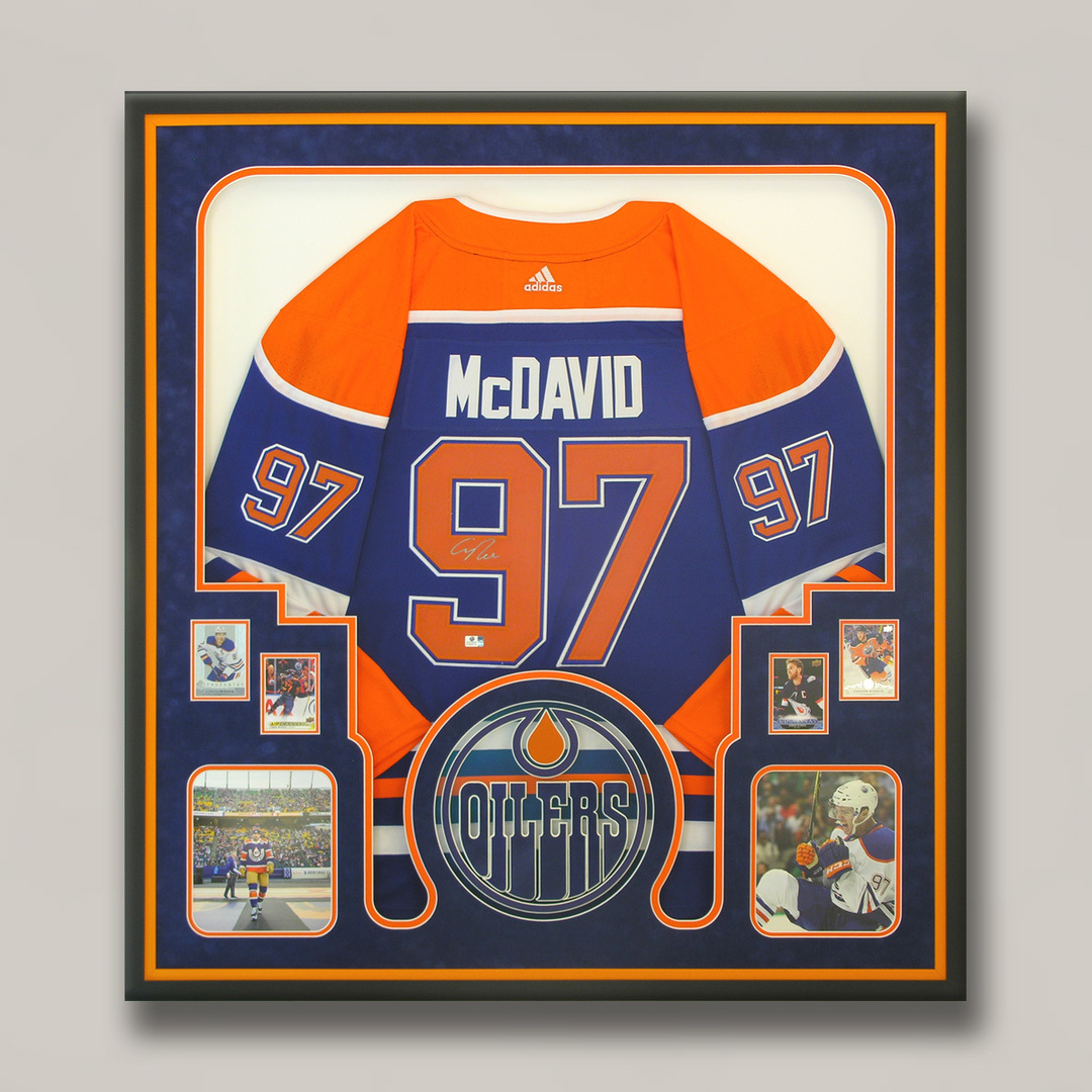 FramingNook's tweet image. McDavid memories each and every day while the signed jersey investment is still rising!  A nicely framed set of memorabilia! #CustomFraming #CustomFrames #RedDeer