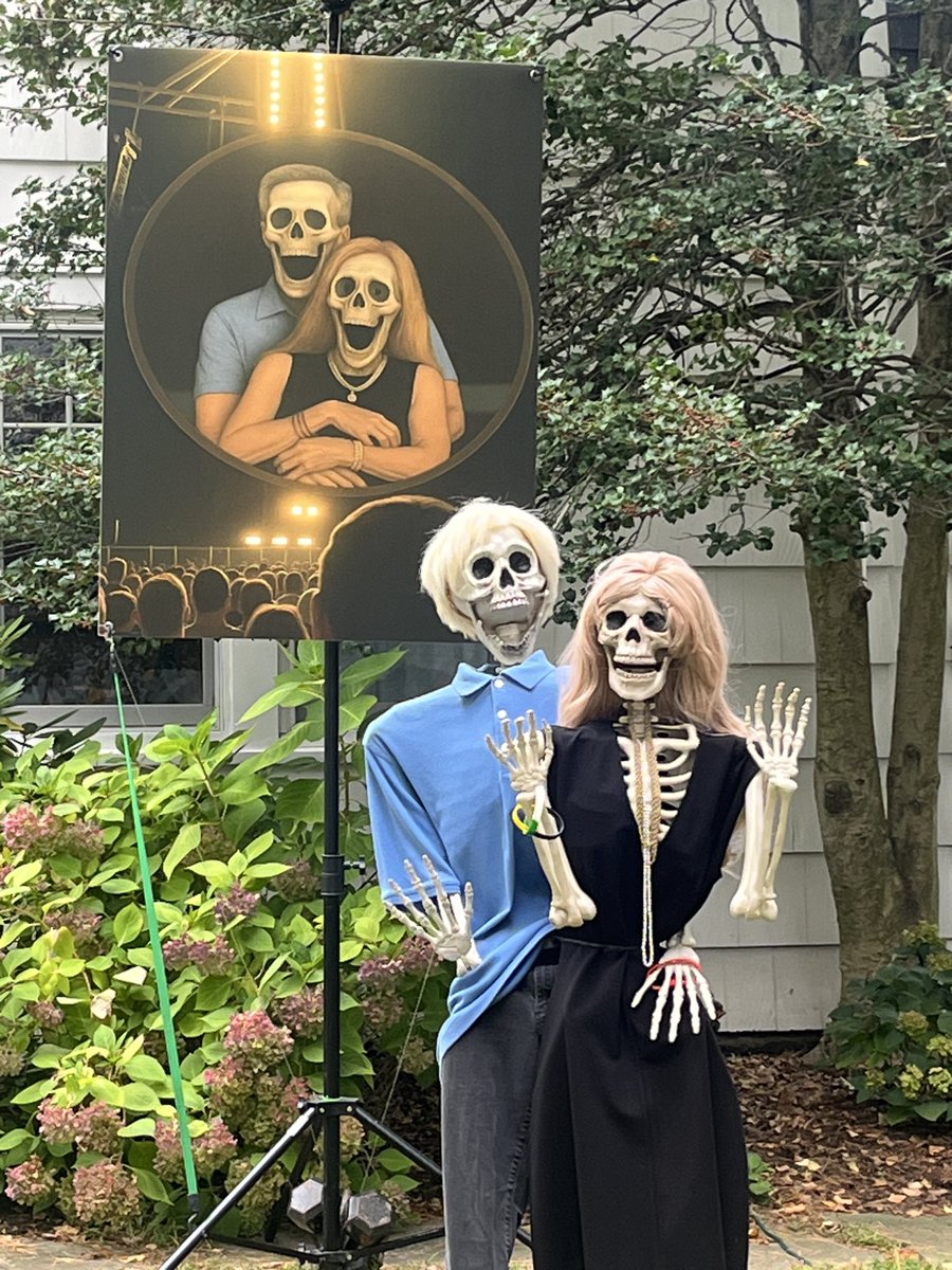 BrianStack153's tweet image. My neighbor Judy hits it out of the park again with her Halloween yard skeletons, this year the busted “Coldplay Couple”.