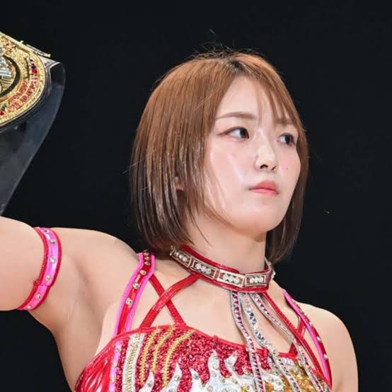 even in agony, her eyes glare upward — fiery, unbroken. Purple stands above her, chest heaving, championship raised like a blade.

Purple Sister: Your passion, Scarlett? It’s toxic. And I’ll poison it again, and again, until it’s gone. Dream all you want — as long as I breathe as