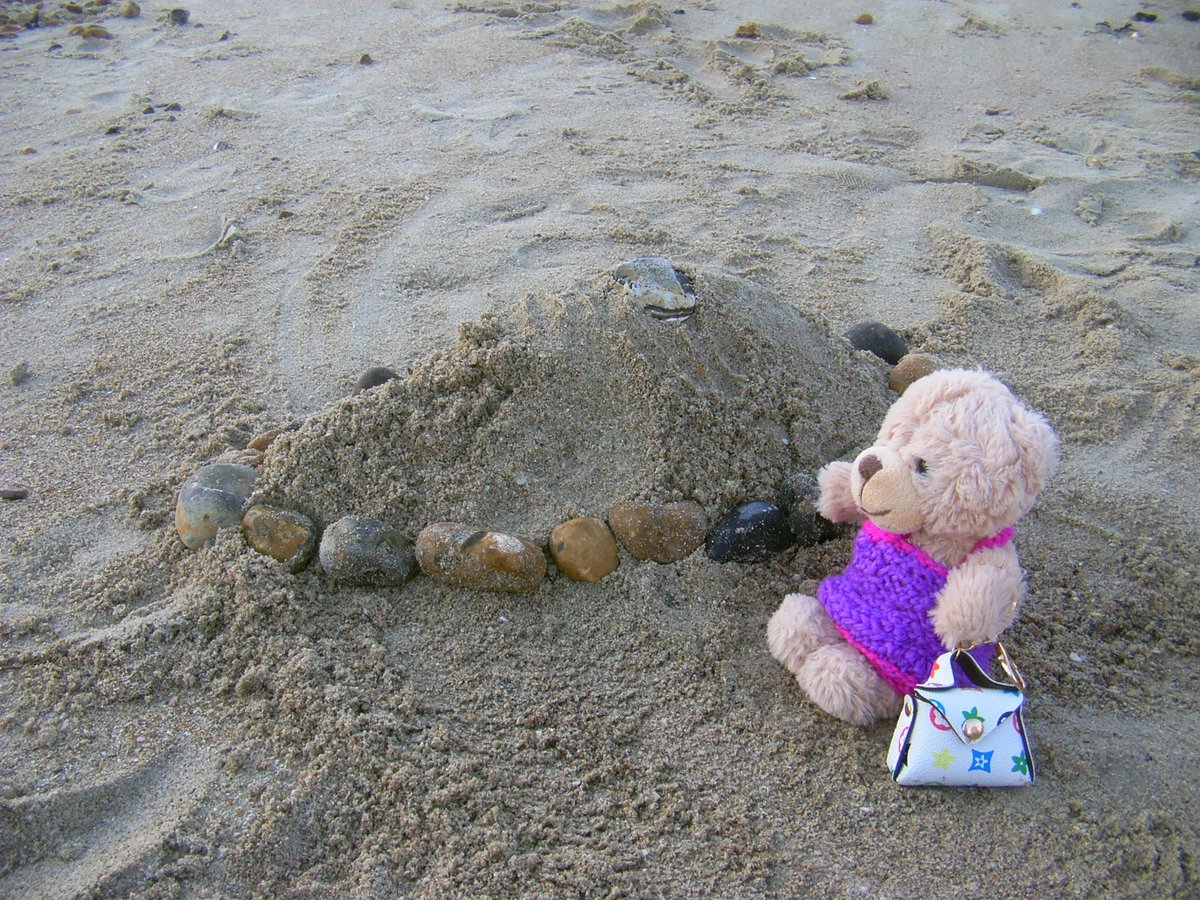 Teddy45825659's tweet photo. At last! It was MY turn to sit in the deckchair. 😊 

Lucky build a sandcastle. 🏰 Well, it was more of a mound because we didn't have space for the bucket in the backpack! 🤣 He put pebbles around it to make a wall. 

I drew Lucky with his sandcastle. What do you think, pals? https://t.co/rrT2h6PPat