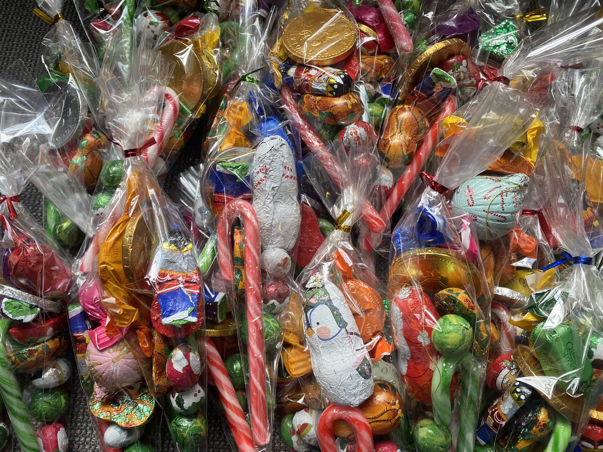 This is what we do with all of the loose sweets, coins and candy cans we collect. Put them into little cellophane bags to make a Christmas treat!