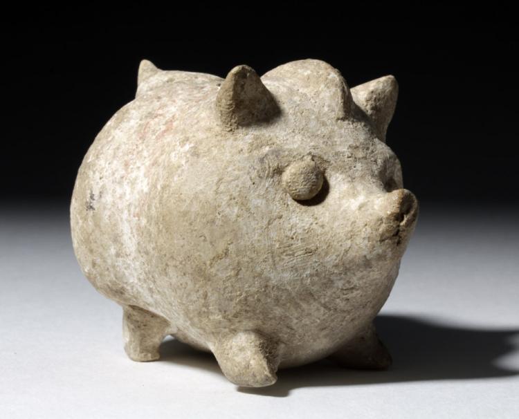 Terracotta rattle in the shape of a pig. Culture: Greek (likely Cypriot), 6th–3rd century BC. Medium: terracotta; hollow-bodied with an internal rattle; pierced vents on top and base. Possibly from Cyprus.