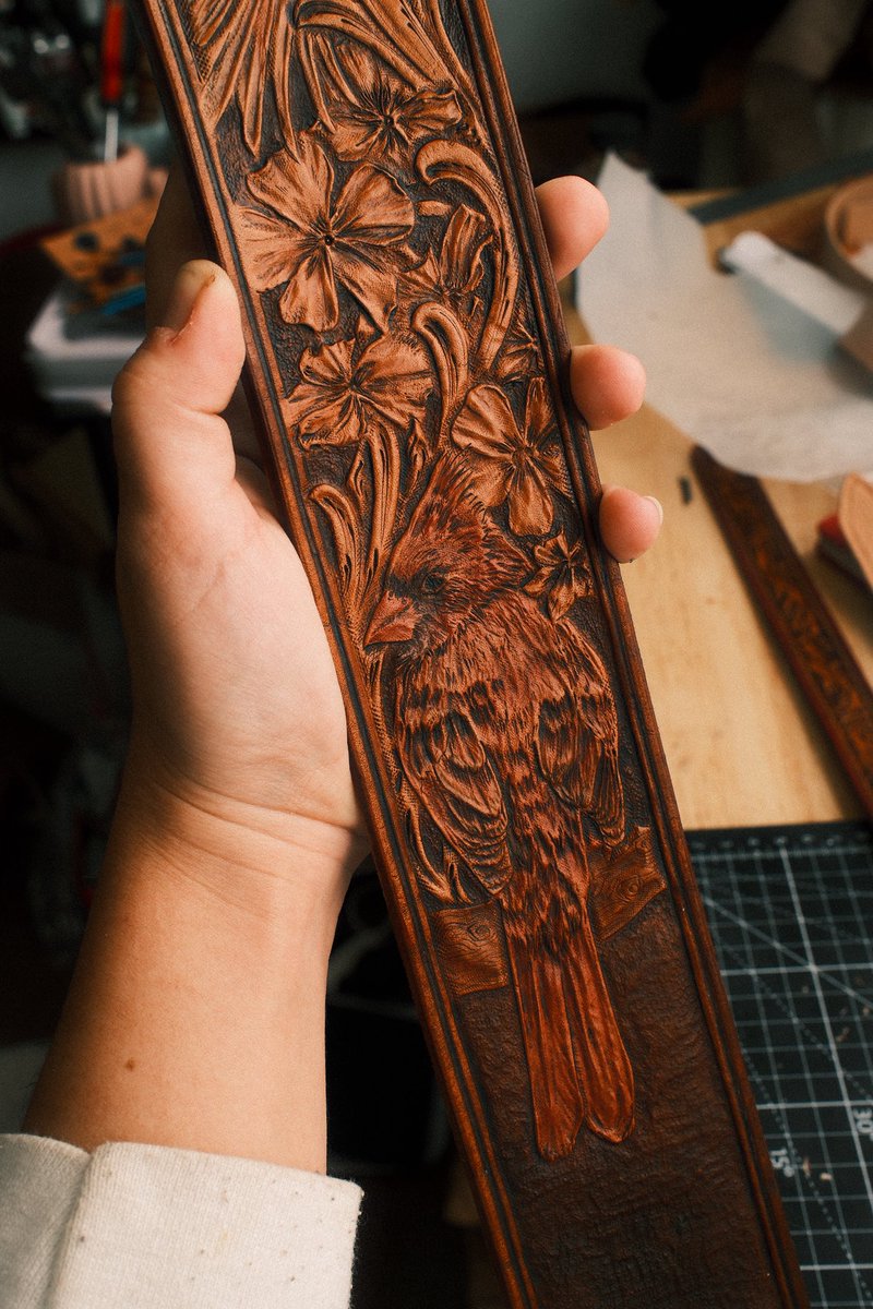 Tooled and carved leather guitar strap of a cardinal and flowers