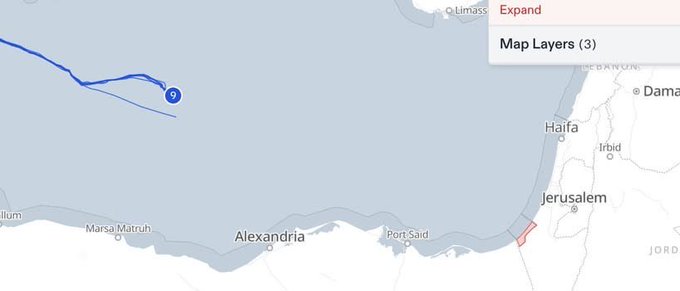 A map showing a blue line and dot in the Mediterranean Sea north of Alexandria, Egypt, indicating the Ship of Conscience\'s location. The map includes coastlines, cities like Alexandria, Haifa, Jerusalem, and Port Said, and a "Map Layers (3)" overlay in the upper right corner. No watermarks are present.
