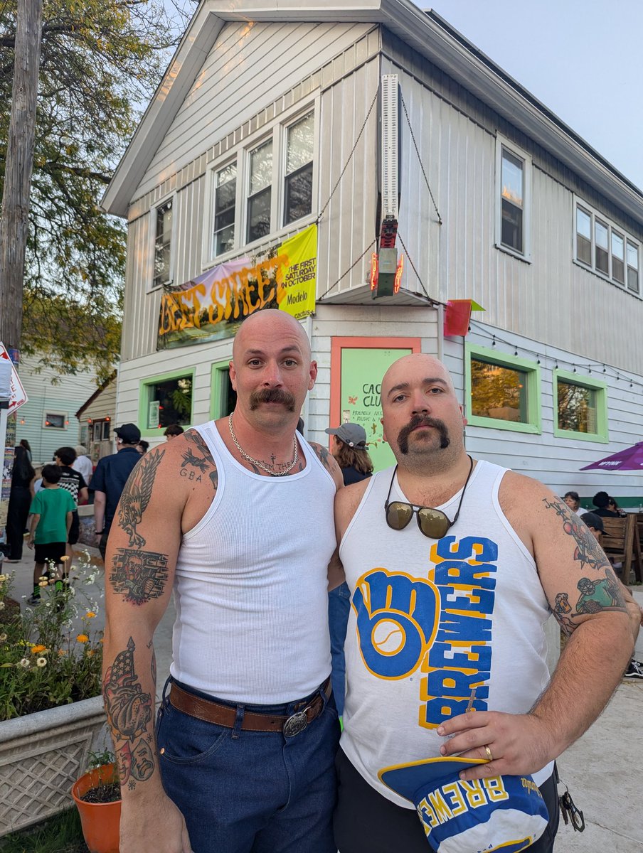 Bald hunks in tanks with mustaches
