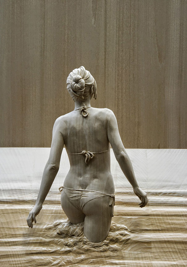 An exquisitely lifelike wood sculpture, hand-carved by Peter Demetz, 2010s.