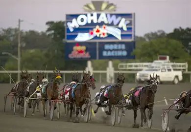AmWager's tweet image. Tonight at @WoodbineSB #Mohawk a $8,380.68 carryover in the Super Hi 5 with race eleven! Watch and wager with AmWager now! First post is 6:35pm ET #WoodbineMohawkPark #HarnessRacing #AmWager🏆💵🐎