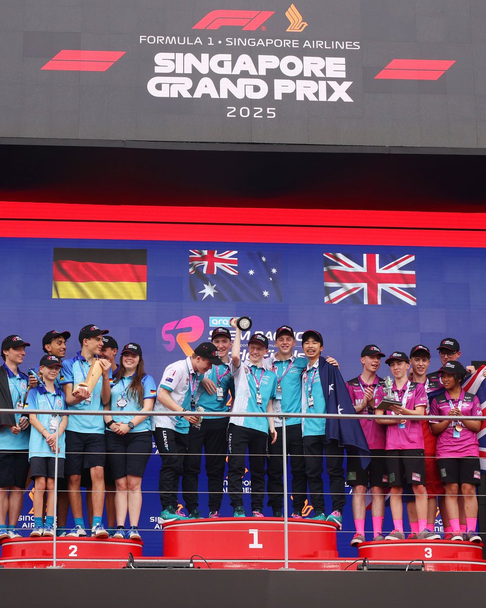 STEMRacingHQ's tweet photo. 🏁 The Singapore GP podium will shine tonight, but Thursday belonged to the STEM stars of the Aramco Racing World Finals 2025!

🥇 Lunar
🥈 Blue Wolves 
🥉 SBA Unity Racing

Trophies by Pedro De La Rosa &amp; Tatyana Dobson — and yes, Lunar did a shoey! 🇦🇺👟🏆 #F1 #STEM https://t.co/kNNgei6djI
