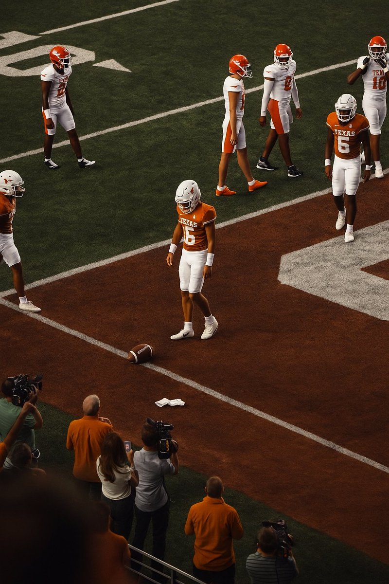 Arch Manning staring down the football after spiking it.