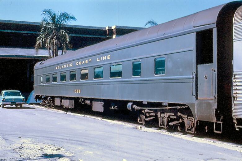 FriendsofTUS's tweet image. Atlantic Coast Line Railroad coach 1066 at Tampa Union Station at the rear of a passenger train in 1970. Who left their seafoam green Ford Falcon sitting at the end of the station platform? From the collection of North East Rails, photographer unknown.