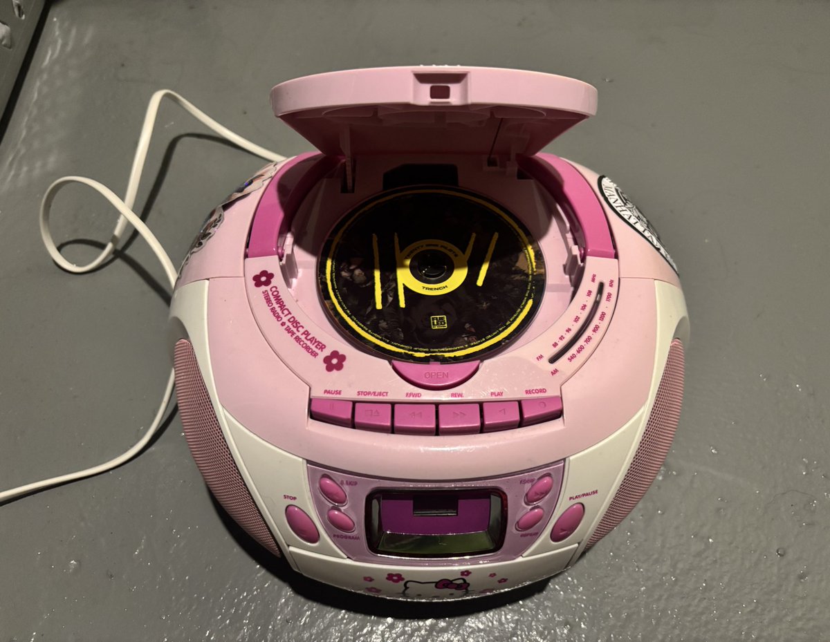 walkoutalone's tweet photo. trench in the hello kitty cd player https://t.co/R6xQ1c3fxC