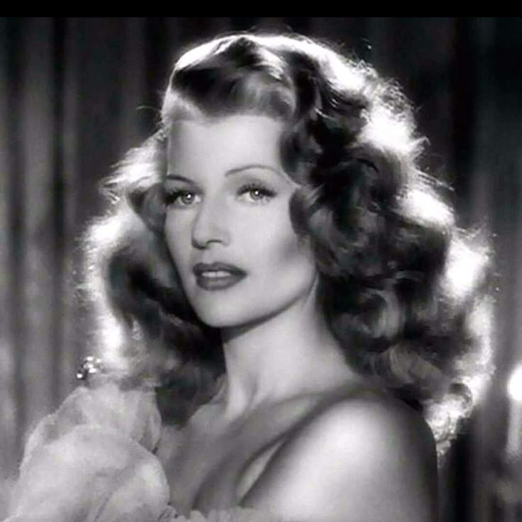 Rita Hayworth - in Gilda 
Beautiful,iconic, feminine, classy
You are born female. No male or man can become a woman.
You can pretend and have all the surgeries, makeup, AI, and so on, but there will only ever be two genders since the beginning of time. Male and female.
Being a