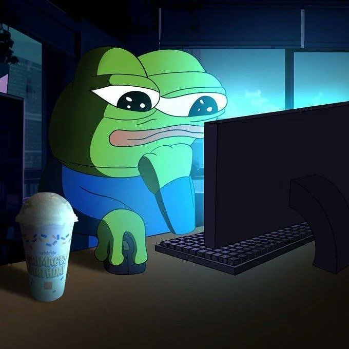 コンピュータのデスクに座るPepe the Frogのミーム
