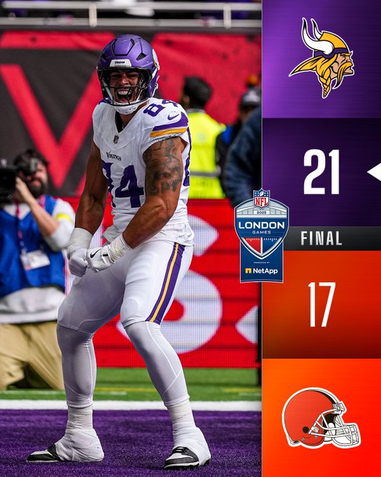A Minnesota Vikings football player wearing a white jersey with purple accents and the number 84, standing on a field. The player has tattoos on his arms and is wearing a purple helmet. The background shows a stadium with a large "V" logo and blurred spectators. A scoreboard overlay displays "21" for the Minnesota Vikings and "17" for the Cleveland Browns, with a "FINAL" label and an NFL London Games logo.