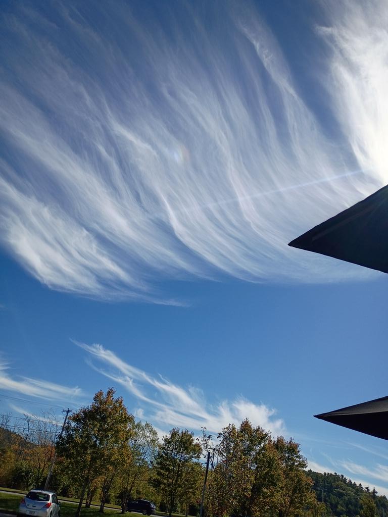 Wild wispy clouds at Starbucks.